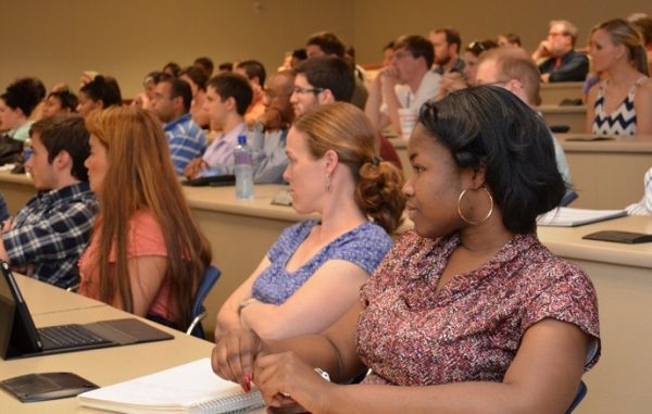 Charlotte Research Scholars in meeting