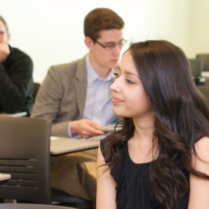 Jessica Calderon listens as a fellow student presents.