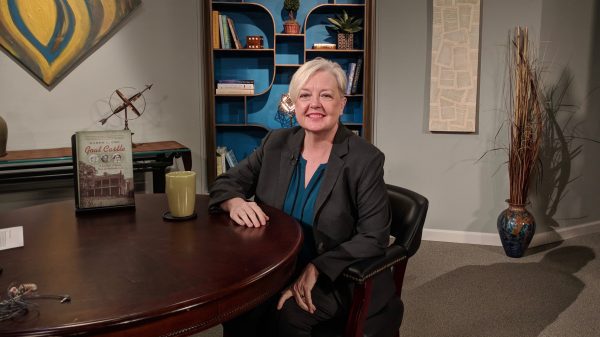 Karen Cox sitting at a table