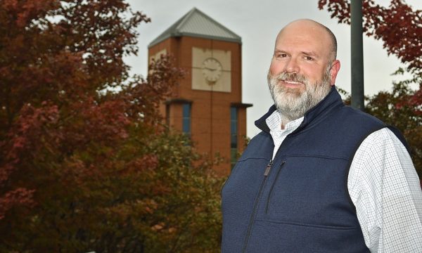 Jon Venable with a clock tower behind him