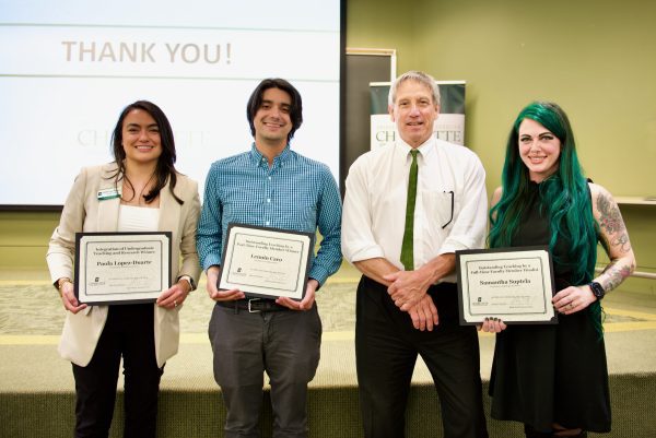 Three award recipients with Interim Dean John Smail