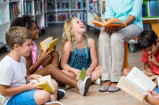 photo of teacher reading to students