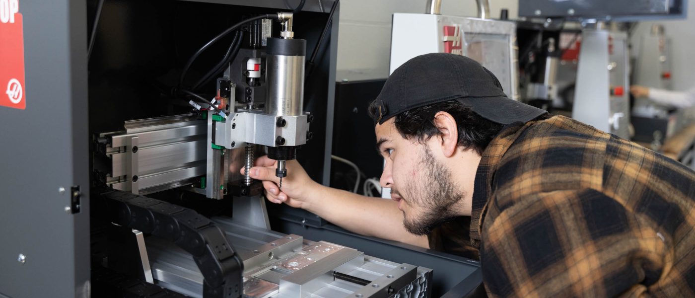Student working at machine in Super Fab Lab